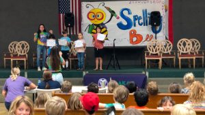 AOK on stage for the annual spelling bee competition. 
