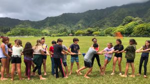 AOK learners playing in a open green field