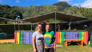 2 AOK teachers standing side by side outside