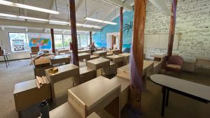 image of large classroom space with several desks