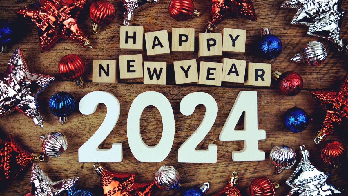 Image of happy new year 2023 in scrabble tiles with colorful border of ornaments